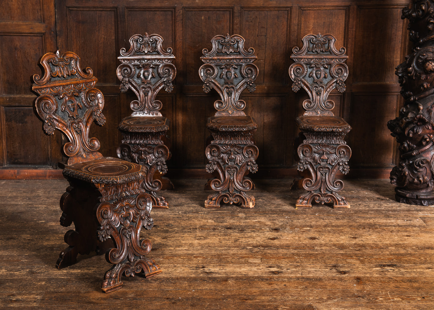 Four Carved Walnut Sgabello Hall Chairs