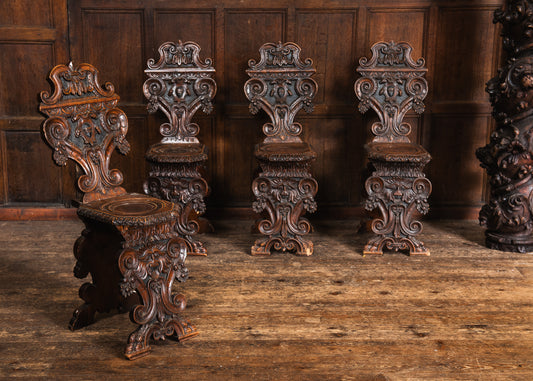 Four Carved Walnut Sgabello Hall Chairs