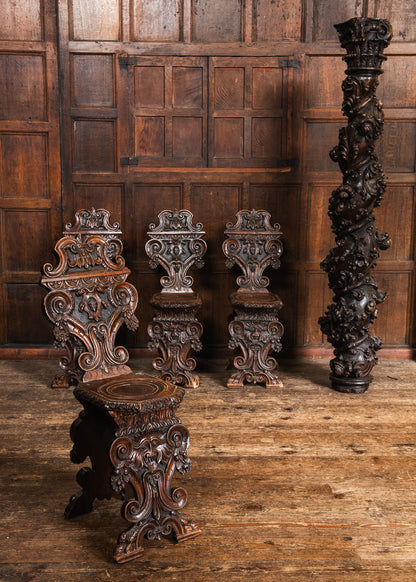 Four Carved Walnut Sgabello Hall Chairs