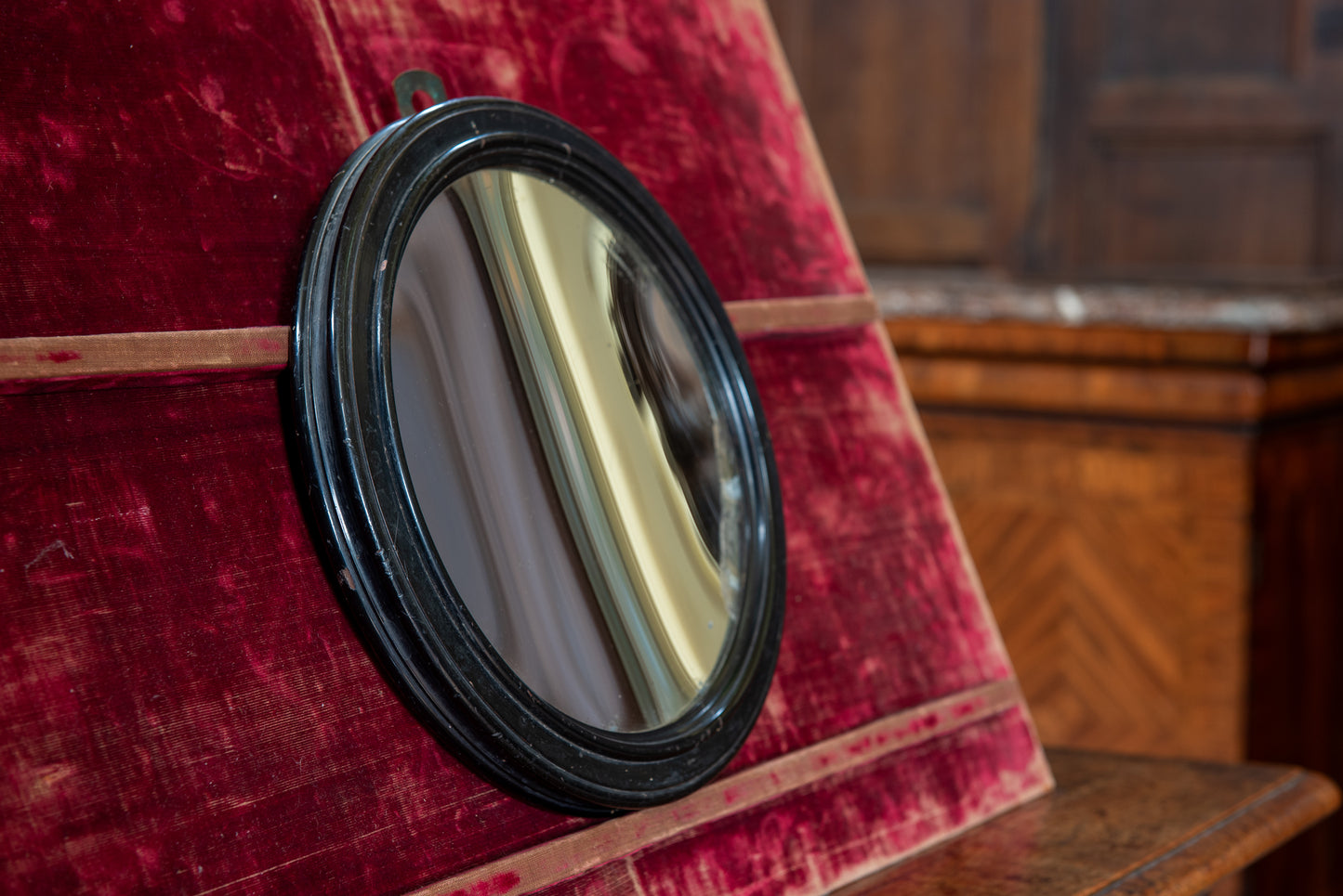 A Small Regency Concave Mirror in an Ebonised Frame