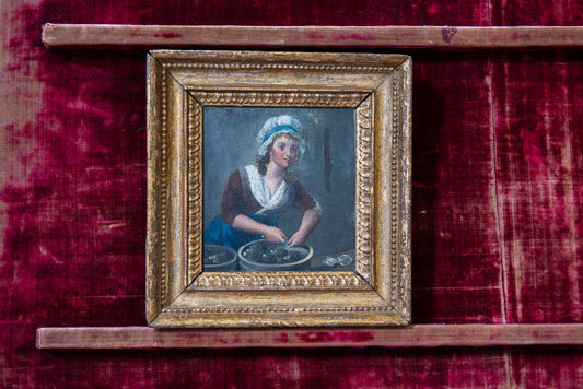 A Young Woman Shucking Oysters