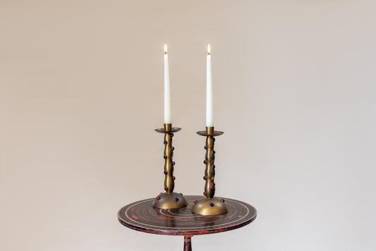 A Pair of Cabochon Mounted Brass Candlesticks
