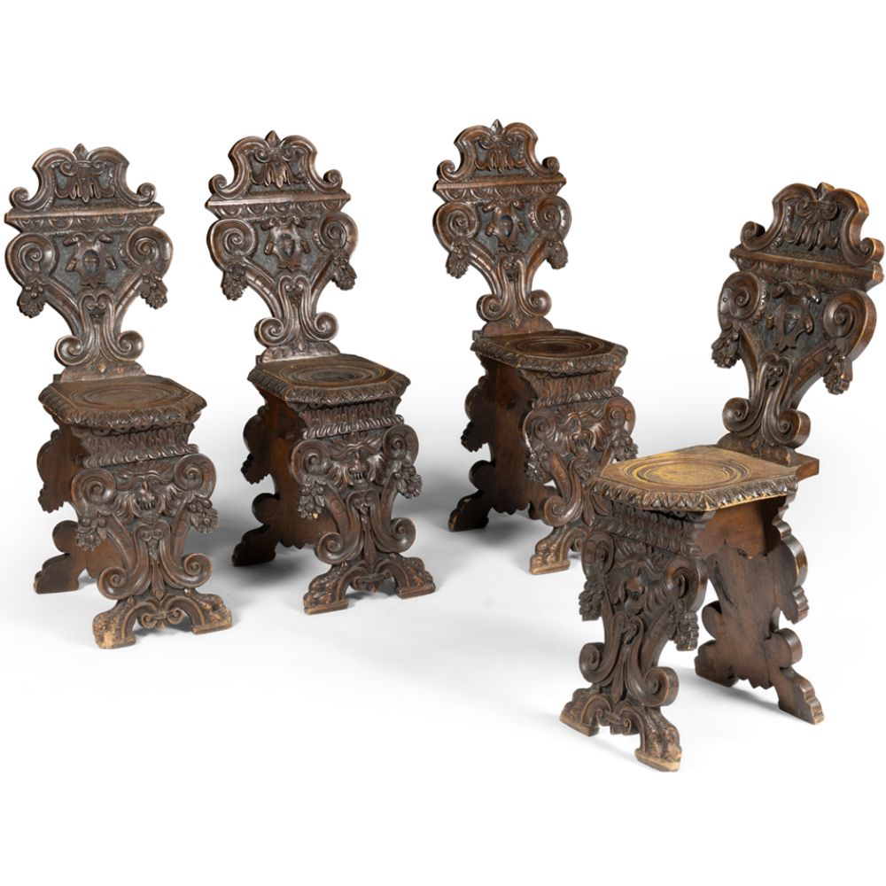 Four Carved Walnut Sgabello Hall Chairs